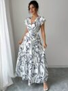 Embrace summer in the Newness Casablanca Floral Print Maxi Dress A chic flowing maxi dress with a vibrant floral print perfect for any occasion