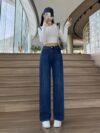 Flatlay of Newness Parisian High Waisted Wide Leg Jeans in a stylish setting The durable denim and flattering wide leg silhouette are highlighted
