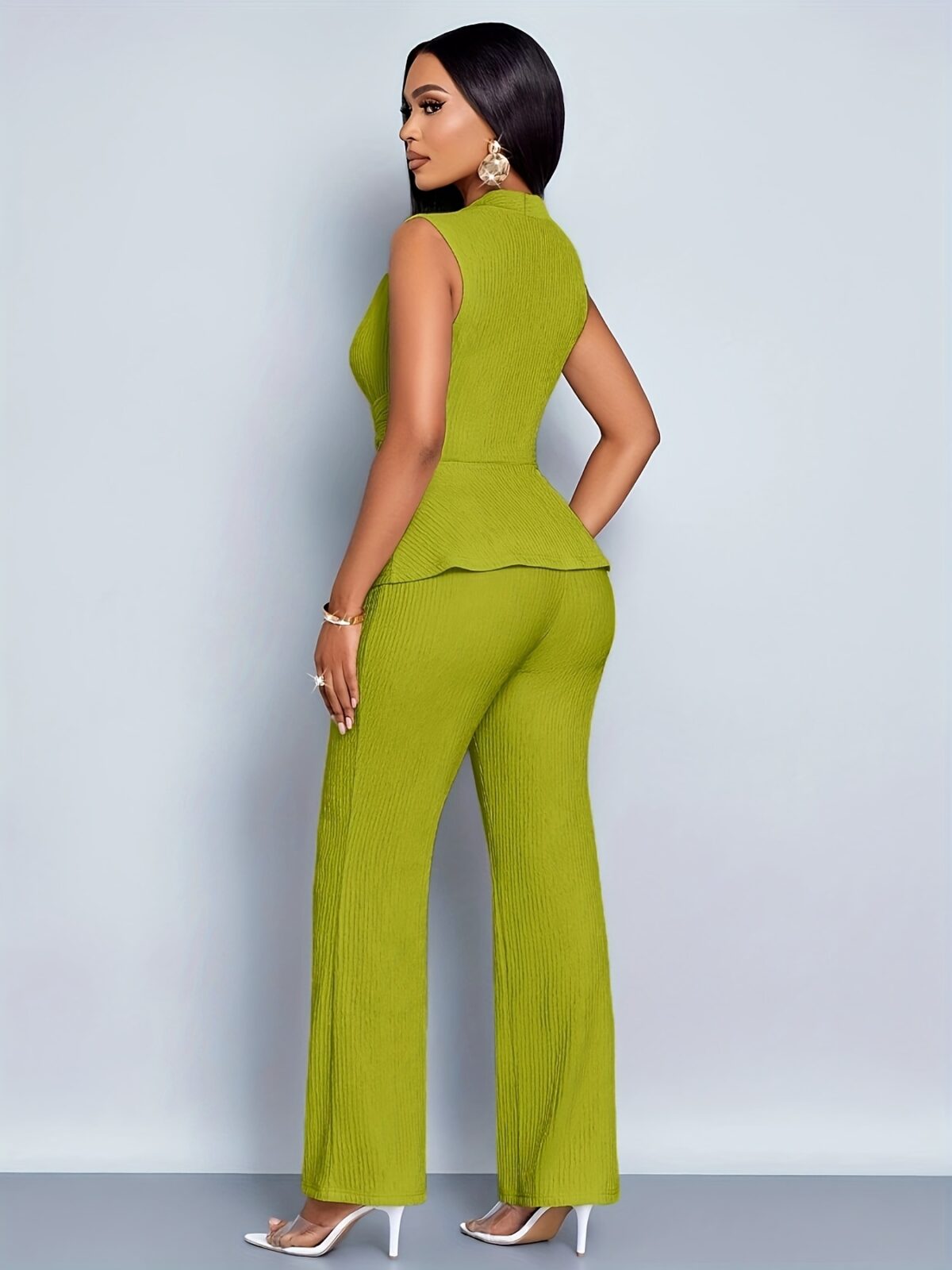 The Newness Milan Ruched Wide Leg Pants Set in a flattering pose showcasing its sophisticated design and chic style Perfect for an evening event