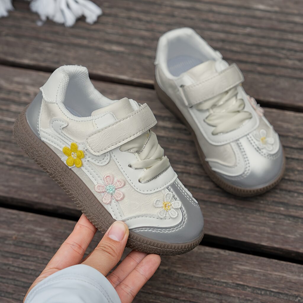 Adorable girls' floral sneakers, perfect for spring. Lightweight, breathable, and soft-soled for comfortable all-day wear.