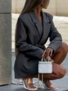 Flatlay of the Timeless Chic Womens Casual Suit Jacket in springfall colors showcasing the double breasted placket and belted waist