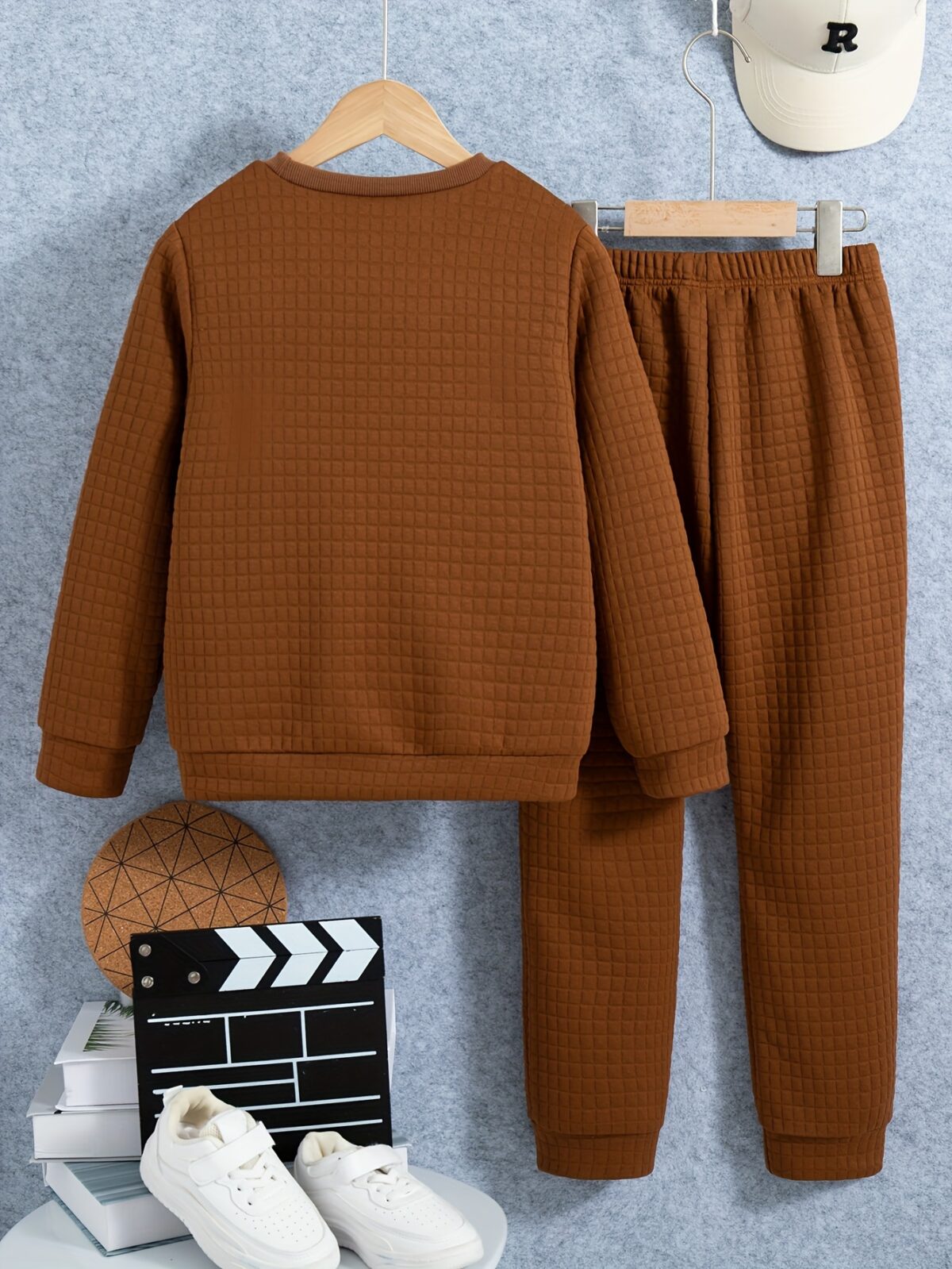 Stylish boys two piece outfit featuring a comfortable long sleeved knit pullover and trendy cargo pants perfect for spring and fall adventures