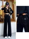 Newness Midnight Hour Black High Waisted Jeans A model showcasing the flattering fit and chic style of the jeans