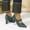 A pair of retro style embroidered womens high heel shoes in a pointed toe design