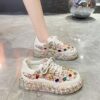 Elevate your style with Newnesss Elevated Rhinestone Platform Sneakers These hand stitched sneakers feature genuine gemstones and a chic platform sole