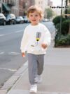 Adorable boys hoodie and sweatpants set featuring a stylish pencil pattern hoodie and comfortable striped sweatpants Perfect for school playdates or cozy days at home