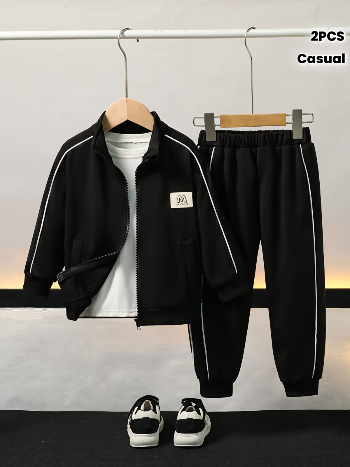 Stylish boys tracksuit set in navy blue with white stripes perfect for active play or casual wear Features a comfortable long sleeve jacket and matching pants