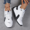 Newness Urban Edge Minimalist Lace Up Sneakers Chic comfortable and perfect for any occasion A close up shot showcasing the minimalist design and lace up detail