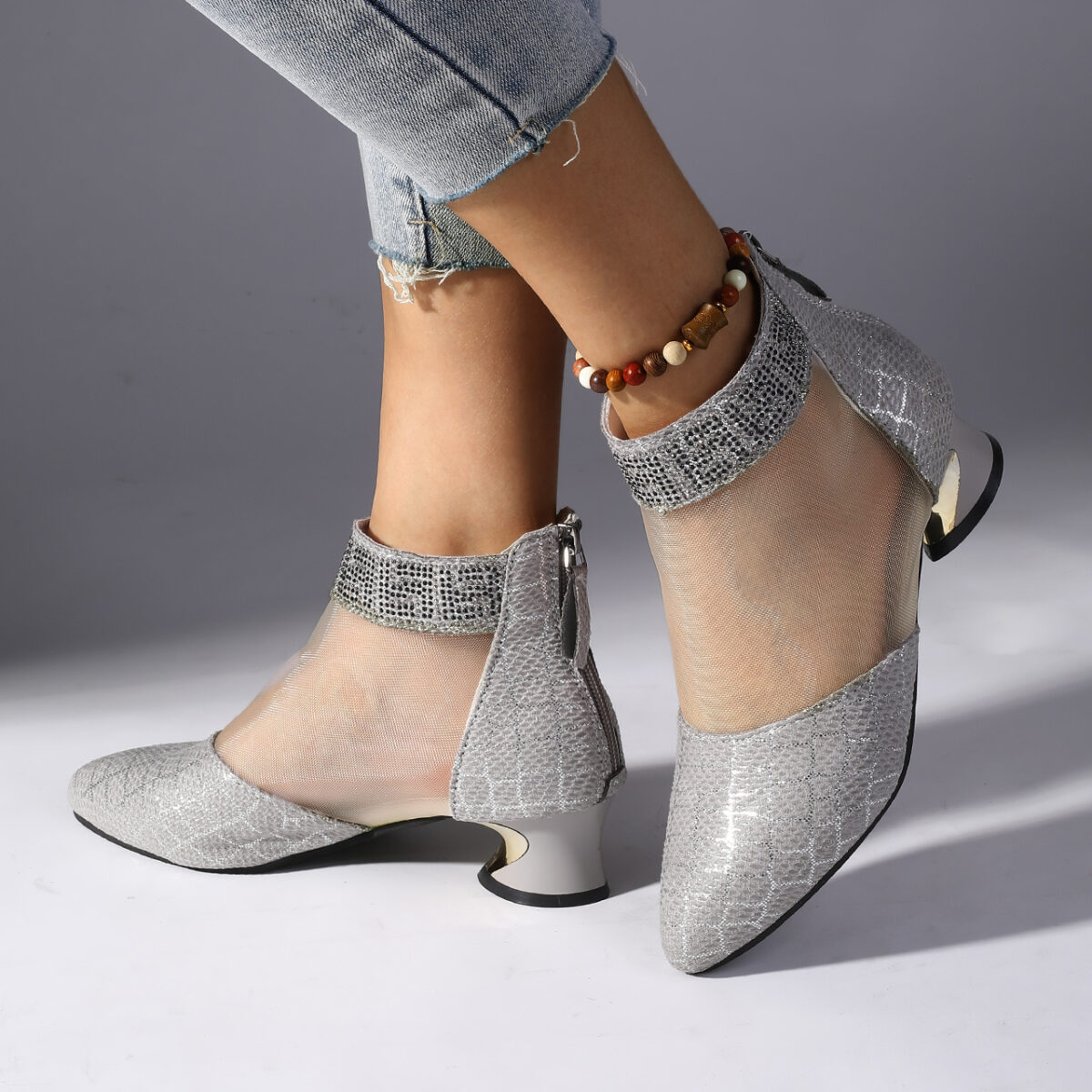 Womens black snakeskin pattern mesh ankle boots with chunky heel pointed toe and rhinestone accents