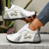 Newness Aurora Luxe White Golden Sneakers Elevate your style with these breathable comfortable sneakers featuring a stylish white and gold design non slip sole perfect for all seasons