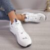 Newness Urban Edge Minimalist Lace Up Sneakers Chic comfortable and perfect for any occasion A close up shot showcasing the minimalist design and lace up detail