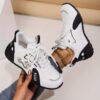 Newness Golden Dragon Accent Black Sneakers Sleek black sneakers adorned with a golden dragon accent showcasing breathable comfort and edgy design