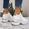 Newness City Chic White Lace Up Sneakers A pair of stylish white lace up sneakers with a modern design showcasing comfort and versatility