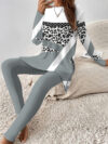 Stylish woman confidently posing in a chic leopard print pantsuit perfect for fall and winter The outfit features a flattering fit and luxurious fabric