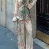 Embrace effortless chic with the Newness Riviera Escape Tropical Print Set This stunning two piece set perfect for vacations and spring outings features a vibrant tropical print and flattering silhouette