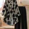 Cairo Chic Geometric Print Suit by Newness A stylish and modern geometric print suit perfect for spring and summer