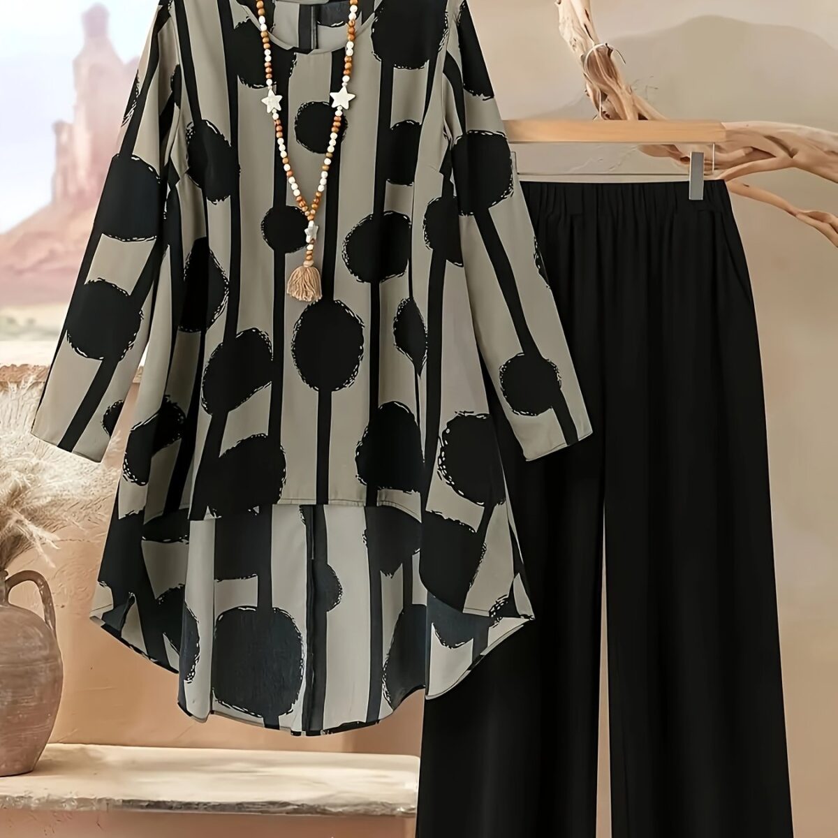Model showcasing the Newness Nian Nian Printed Suit Set a sophisticated and effortlessly chic printed suit set perfect for any occasion
