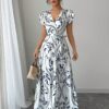 Embrace summer in the Newness Casablanca Floral Print Maxi Dress A chic flowing maxi dress with a vibrant floral print perfect for any occasion