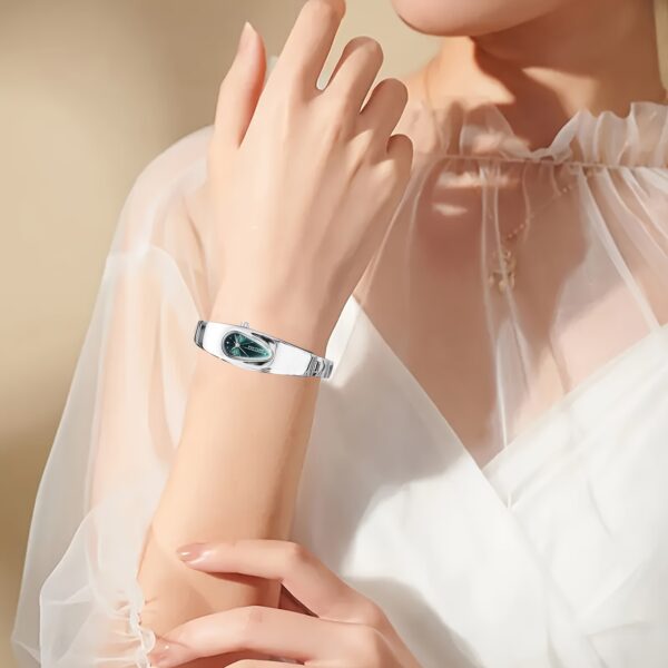 Celestial Dewdrop Water Drop Watch: A close-up view of the elegant, minimalist PINTIME watch, showcasing its unique waterdrop design and sophisticated style.