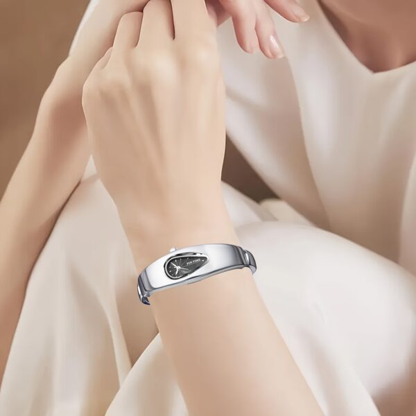 Celestial Dewdrop Water Drop Watch: A close-up view of the elegant, minimalist PINTIME watch, showcasing its unique waterdrop design and sophisticated style.